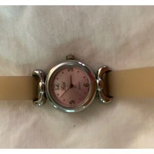LTD Ladies Watch. Silver with tan silicone band.